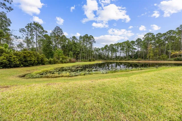 a view of patio with couches and pool