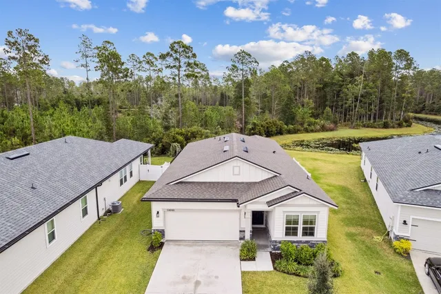 a view of a house with swimming pool and porch