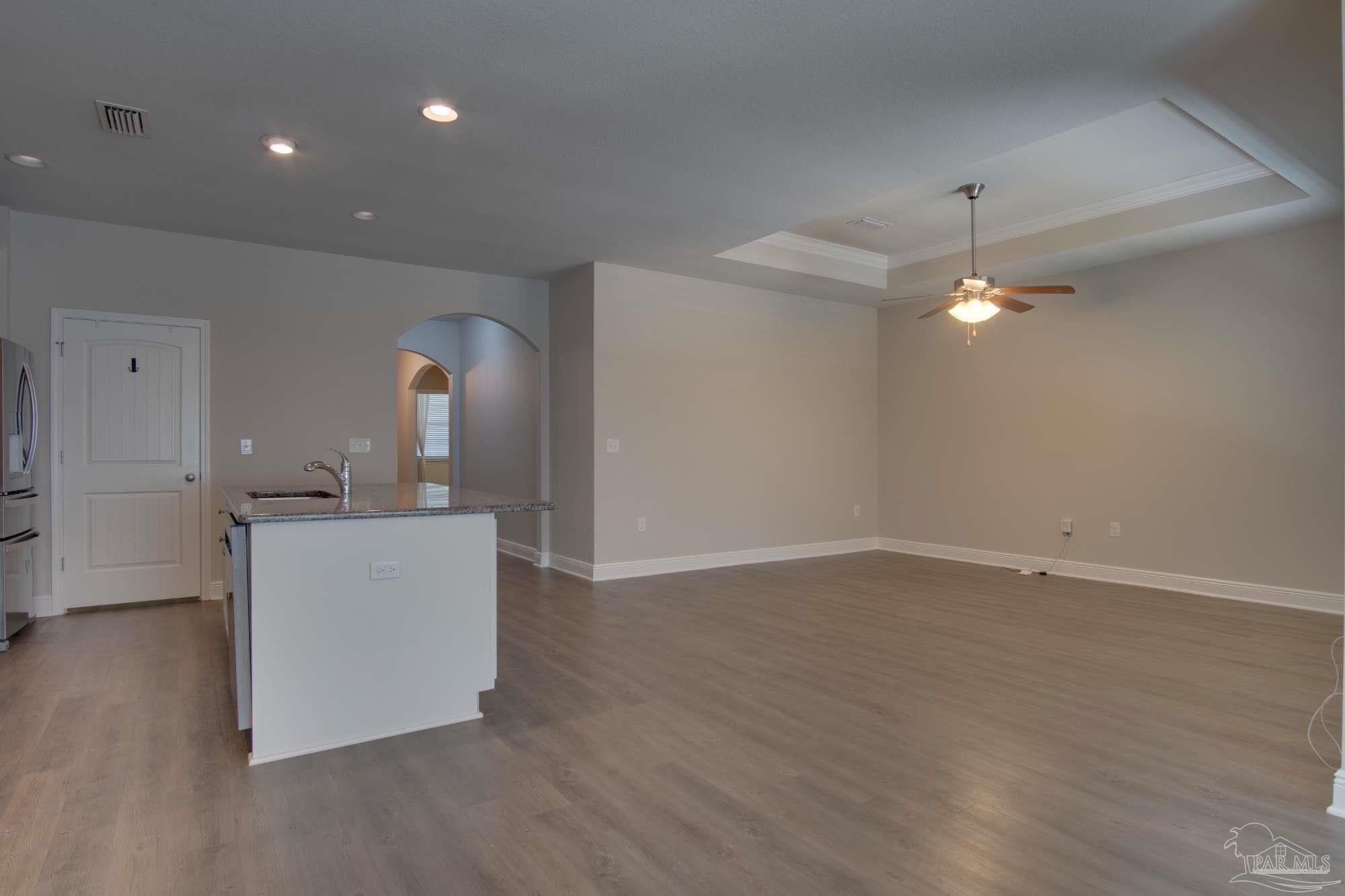 6239 Ladera Trail Pace, FL 32571 - Photo 7 of 27 a room with a sink and chandelier