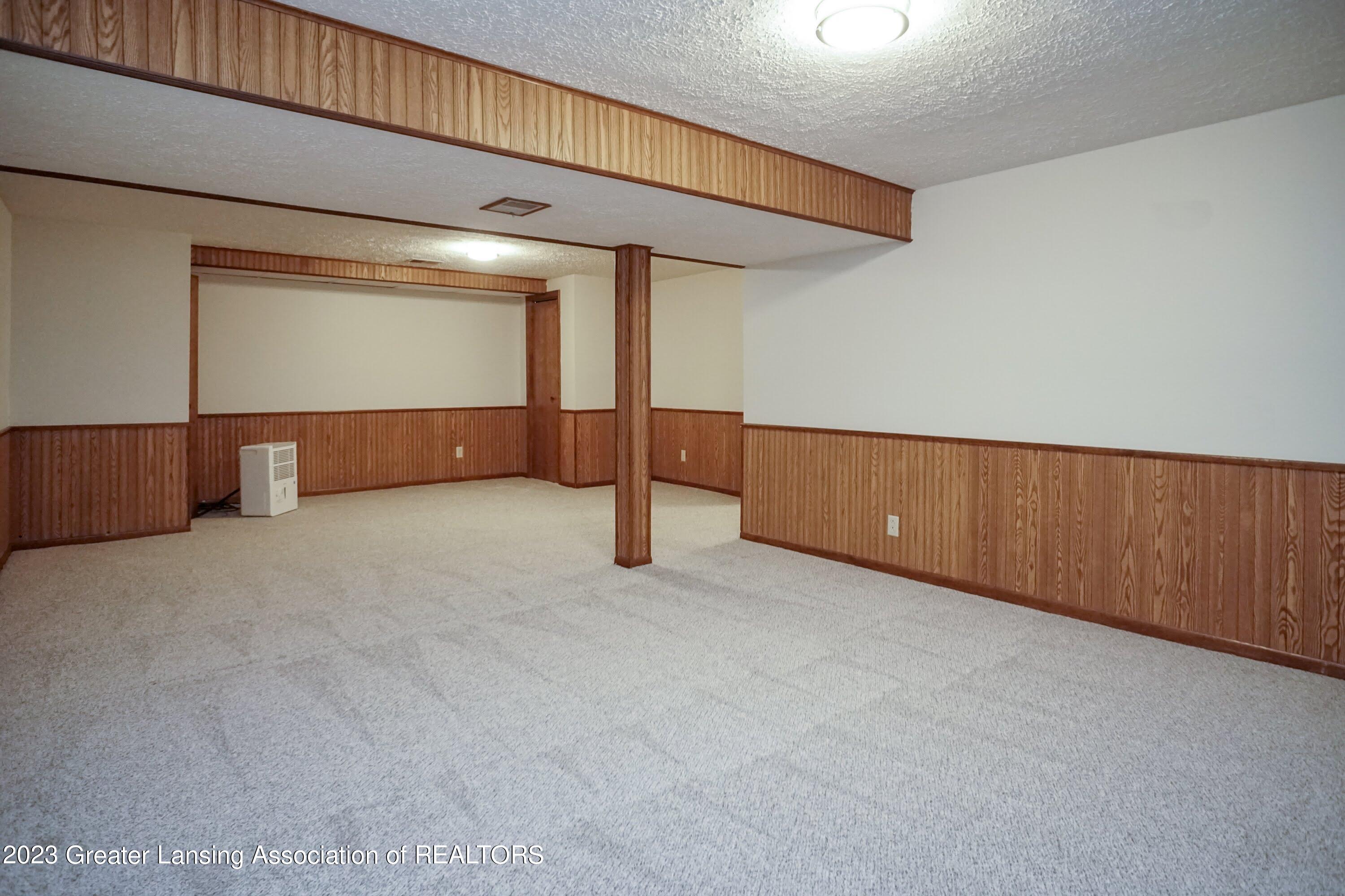 5872 Green Road Haslett, MI 48840 - Photo 21 of 31 Rec Area Basement 2