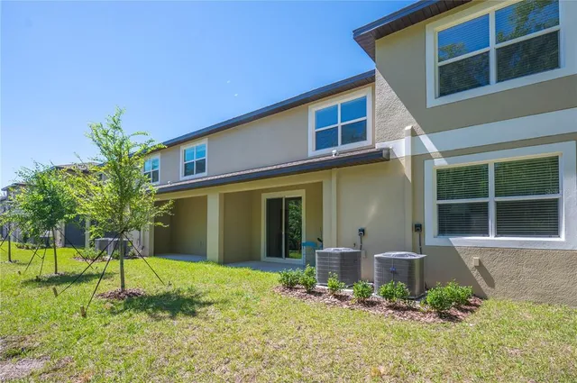 a view of house with yard