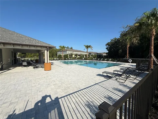 a view of a patio with swimming pool