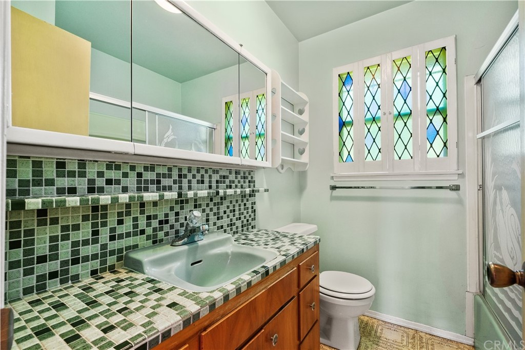 7119 Cortland Avenue Paramount, CA 90723 - Photo 19 of 30 a bathroom with a sink and mirror