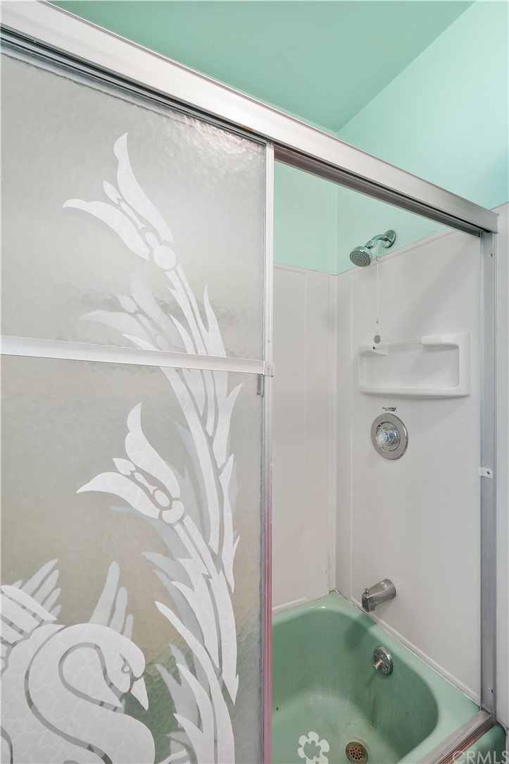 7119 Cortland Avenue Paramount, CA 90723 - Photo 20 of 30 a bathroom with a shower and a sink