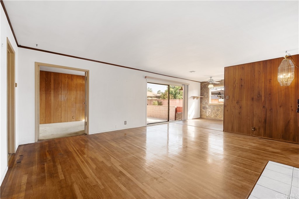 7119 Cortland Avenue Paramount, CA 90723 - Photo 4 of 30 a view of an empty room with wooden floor and a window