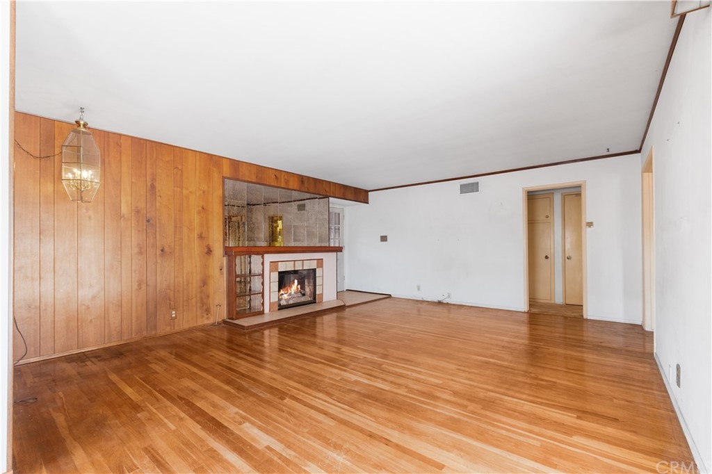 7119 Cortland Avenue Paramount, CA 90723 - Photo 8 of 30 a view of an empty room with wooden floor