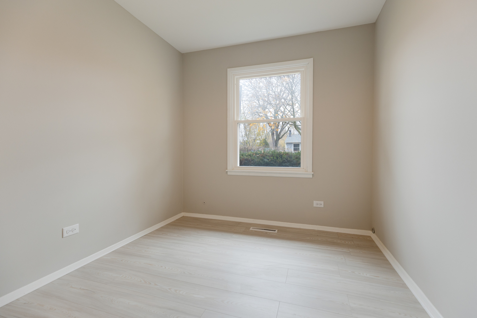 6971 Hanover Street Hanover Park, IL 60133 - Photo 11 of 20 an empty room with a window