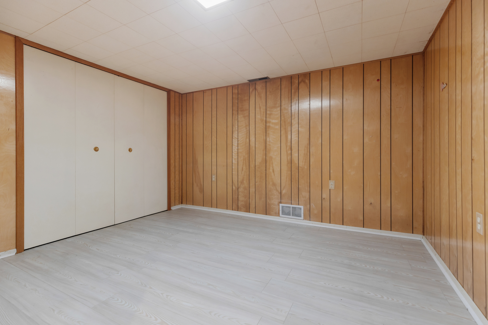 6971 Hanover Street Hanover Park, IL 60133 - Photo 12 of 20 a view of an empty room with wooden floor