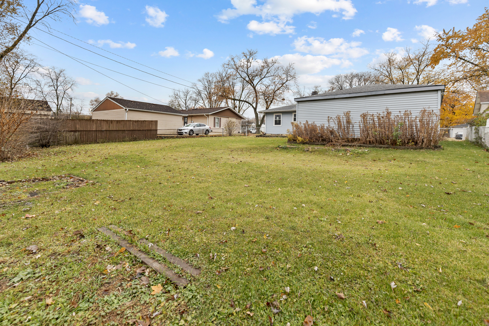 6971 Hanover Street Hanover Park, IL 60133 - Photo 17 of 20 a view of a house with a yard