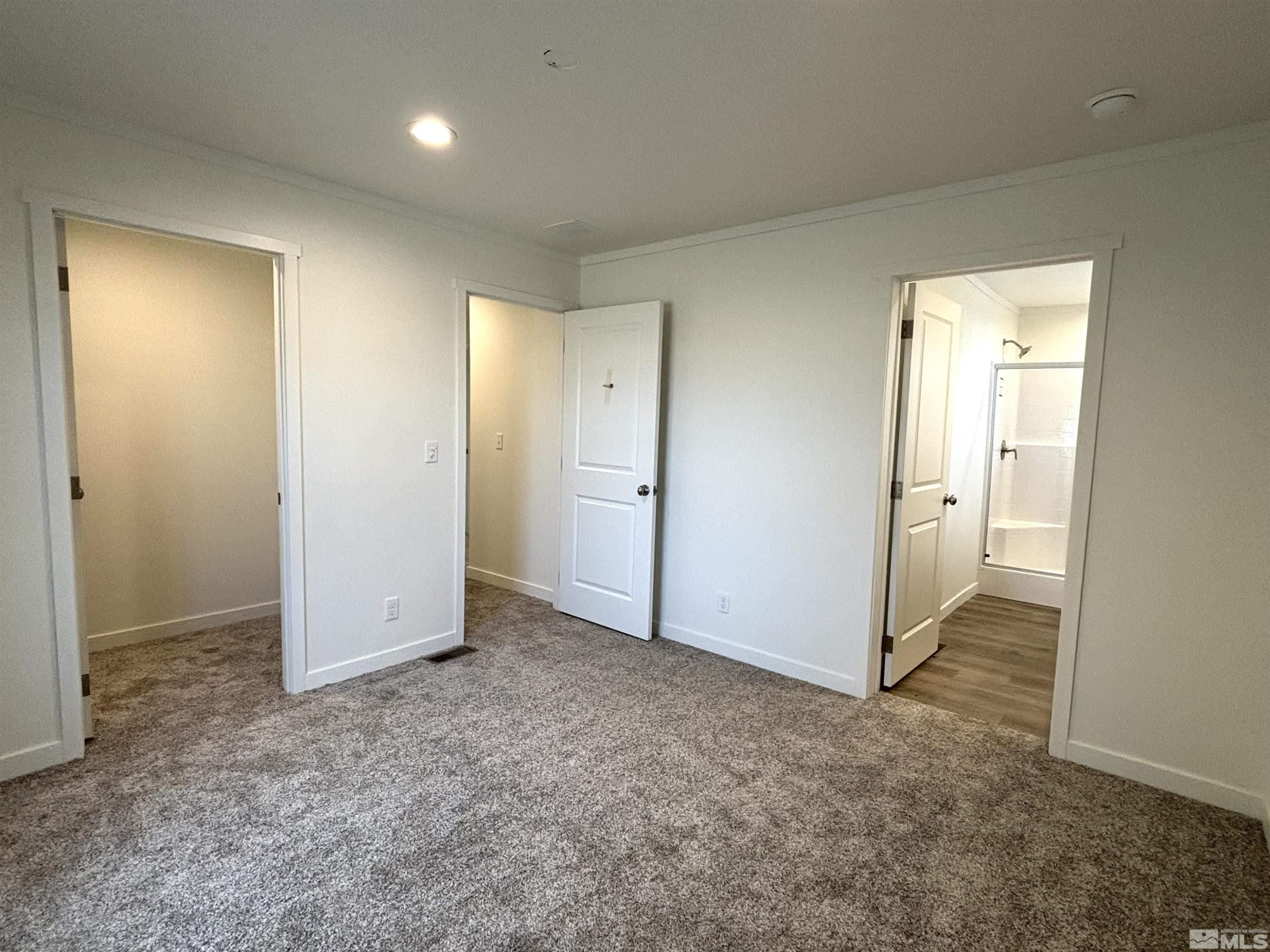 475 Camellia Way Lovelock, NV 89419 - Photo 13 of 23 an empty room with closet and a bathroom