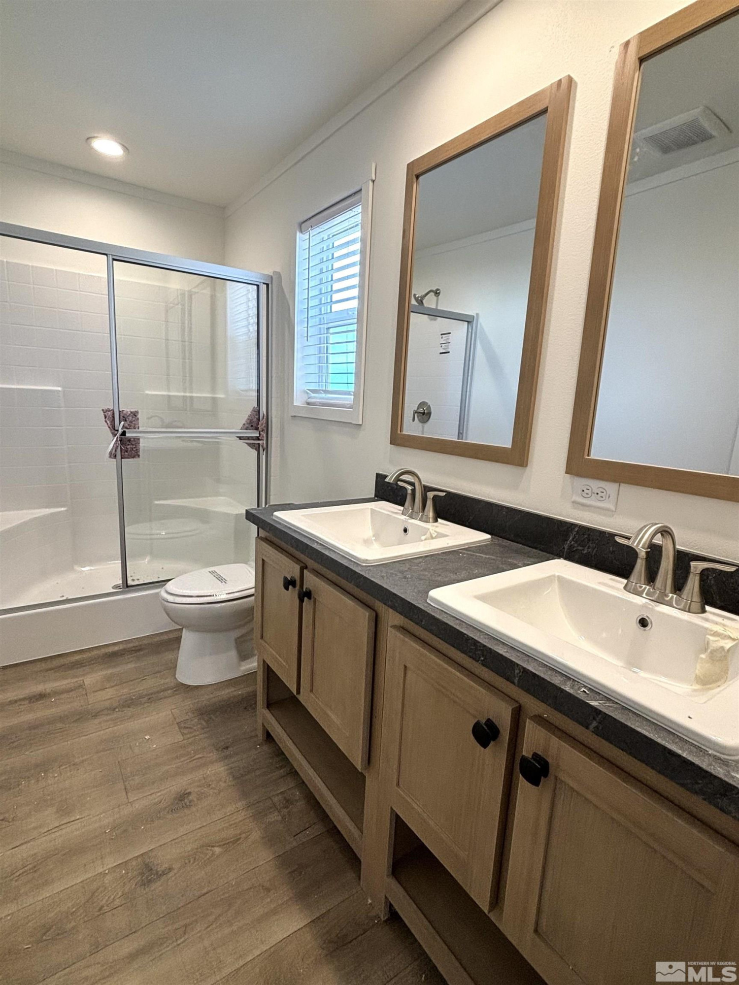 475 Camellia Way Lovelock, NV 89419 - Photo 15 of 23 a bathroom with a double vanity sink toilet and shower
