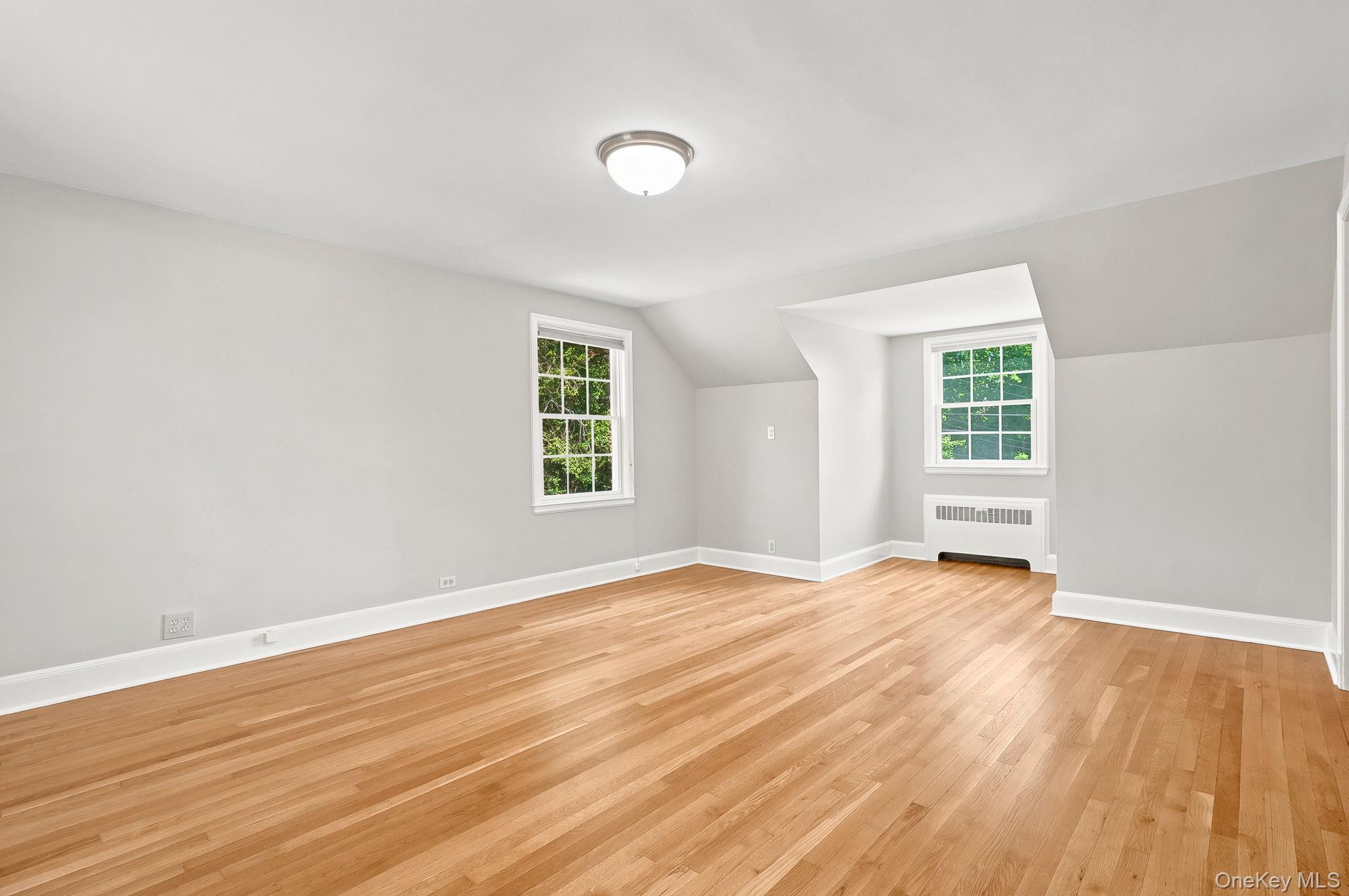 1 Sheridan Road Scarsdale, NY 10583 - Photo 20 of 40 Spacious primary bedroom showing two of three exposures