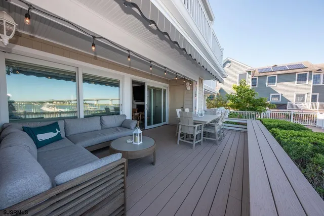 a view of a patio with couches table and chairs