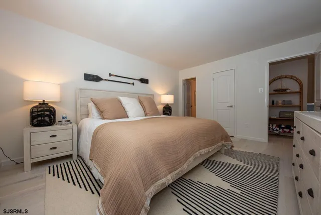 a bedroom with a bed and a view of bedroom