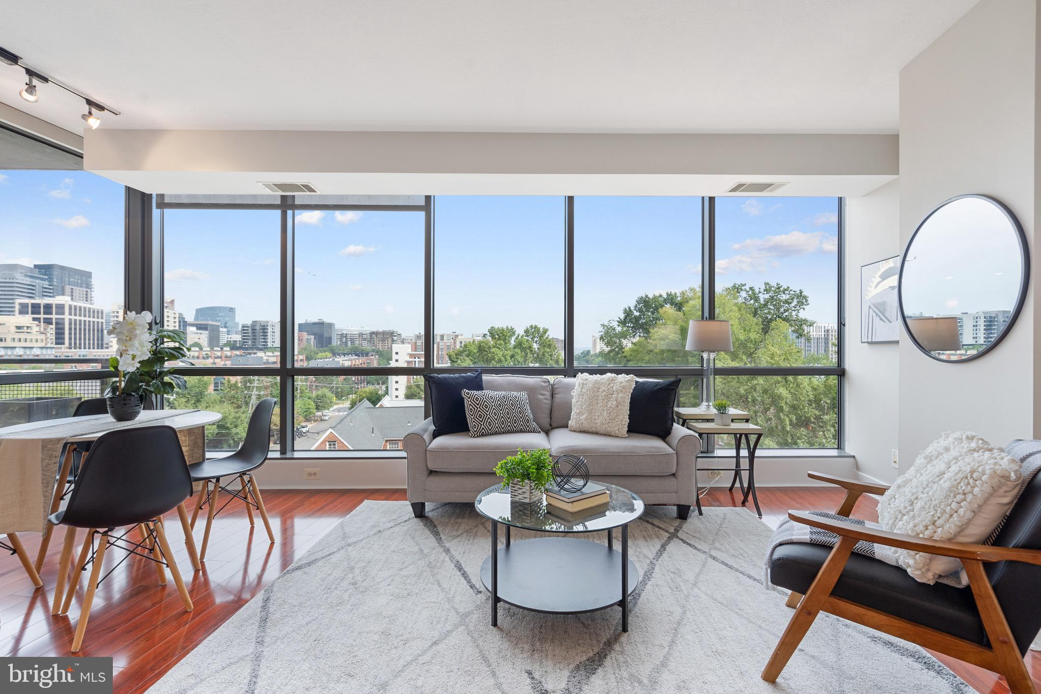 2001 15th Street North, Unit 306 Arlington, VA 22201 - Photo 21 of 56 a living room with furniture and a large window