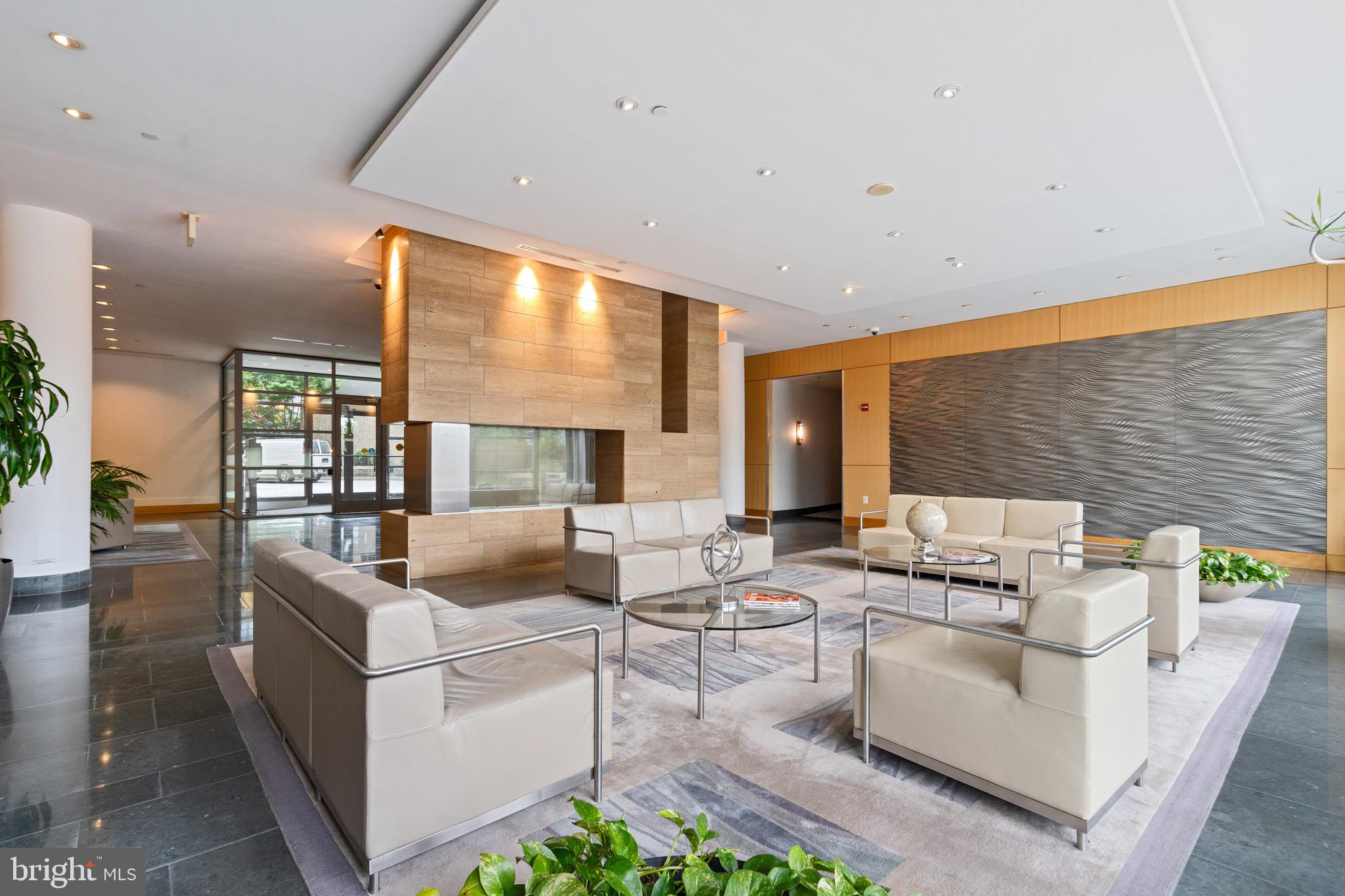 2001 15th Street North, Unit 306 Arlington, VA 22201 - Photo 49 of 56 a living room with fireplace furniture and a large window