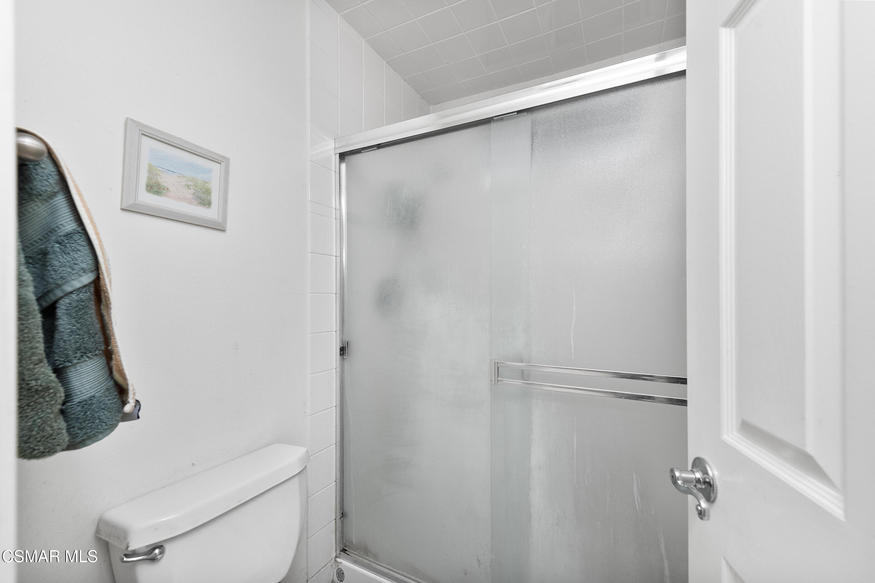 6464 Hazel Circle Simi Valley, CA 93063 - Photo 26 of 42 a white toilet sitting next to a shower