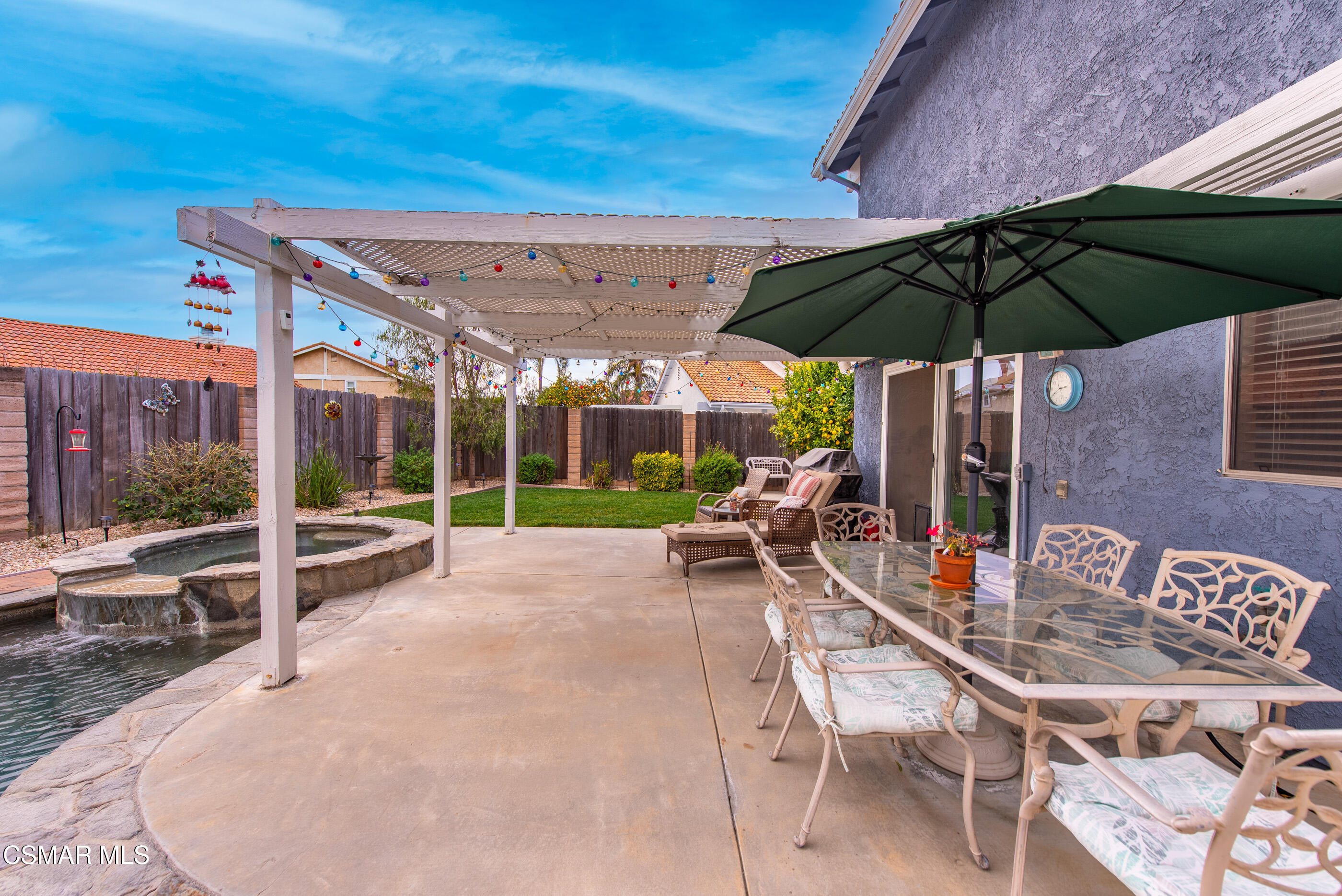 6464 Hazel Circle Simi Valley, CA 93063 - Photo 36 of 42 a view of a table and chairs under an umbrella