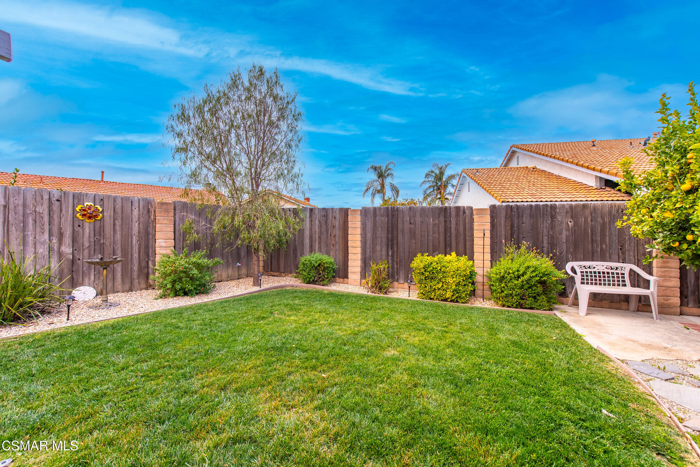 6464 Hazel Circle Simi Valley, CA 93063 - Photo 39 of 42 a view of a chair and table in the backyard of the house