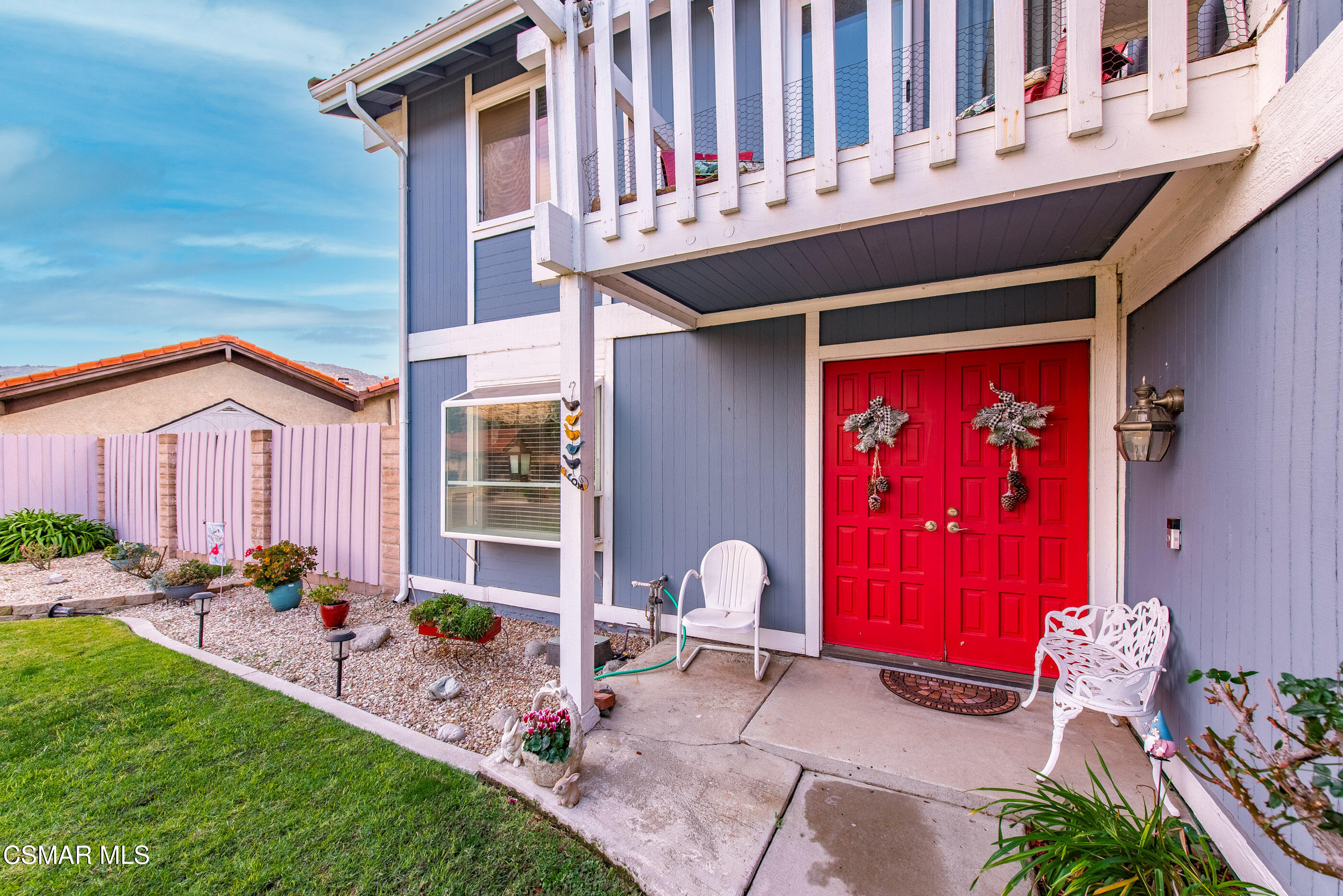 6464 Hazel Circle Simi Valley, CA 93063 - Photo 6 of 42 a front view of a house with outdoor seating and a patio
