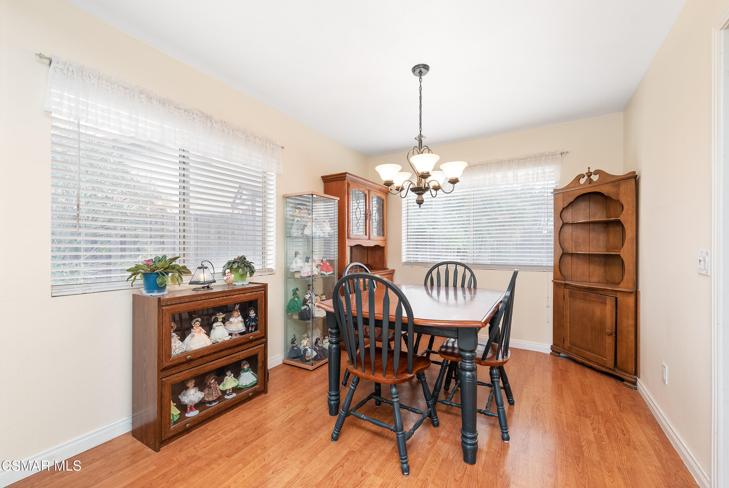 6464 Hazel Circle Simi Valley, CA 93063 - Photo 10 of 42 a view of a dining room with furniture window and wooden floor
