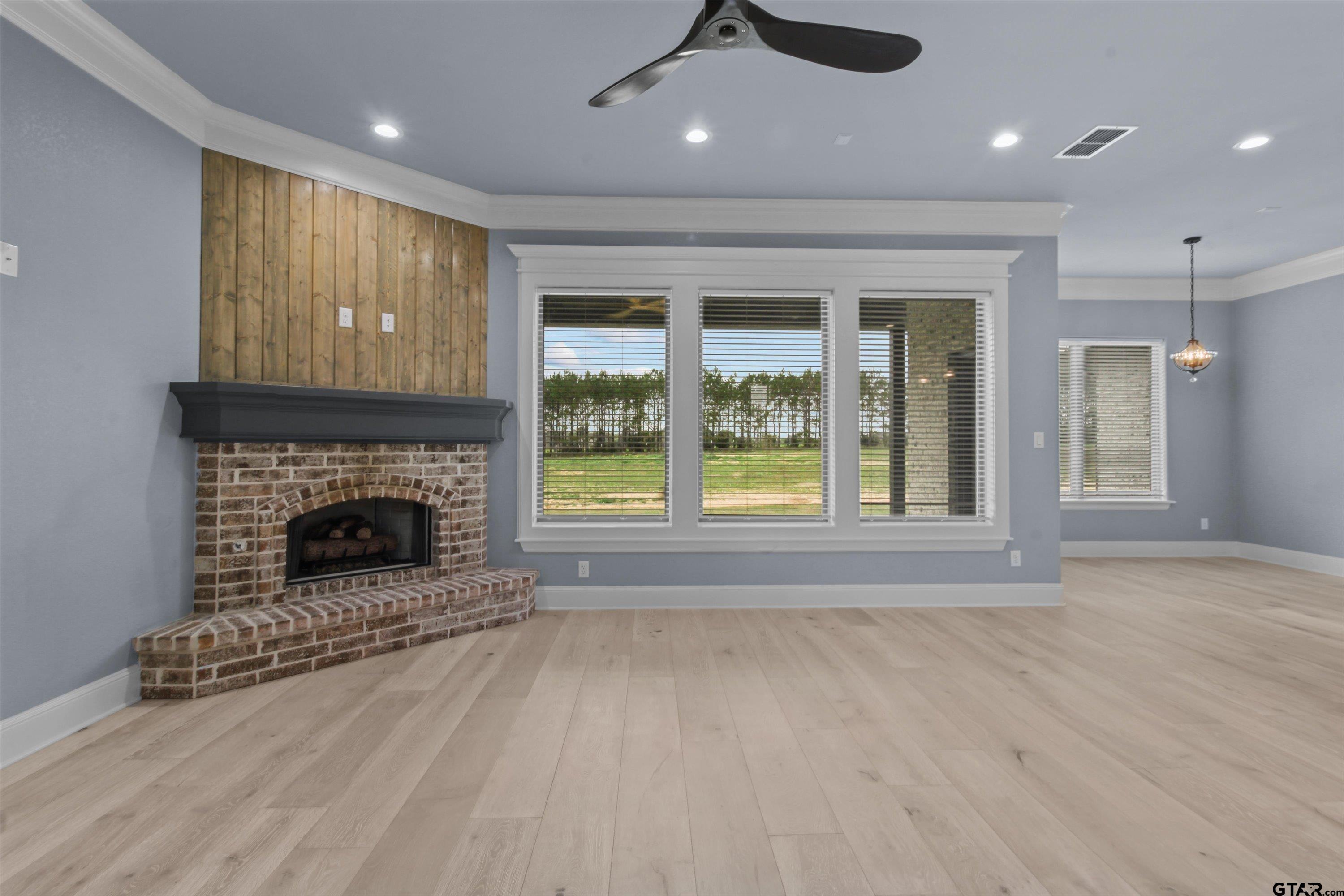 11236 Bryce Circle Flint, TX 75762 - Photo 12 of 44 an empty room with windows and fireplace