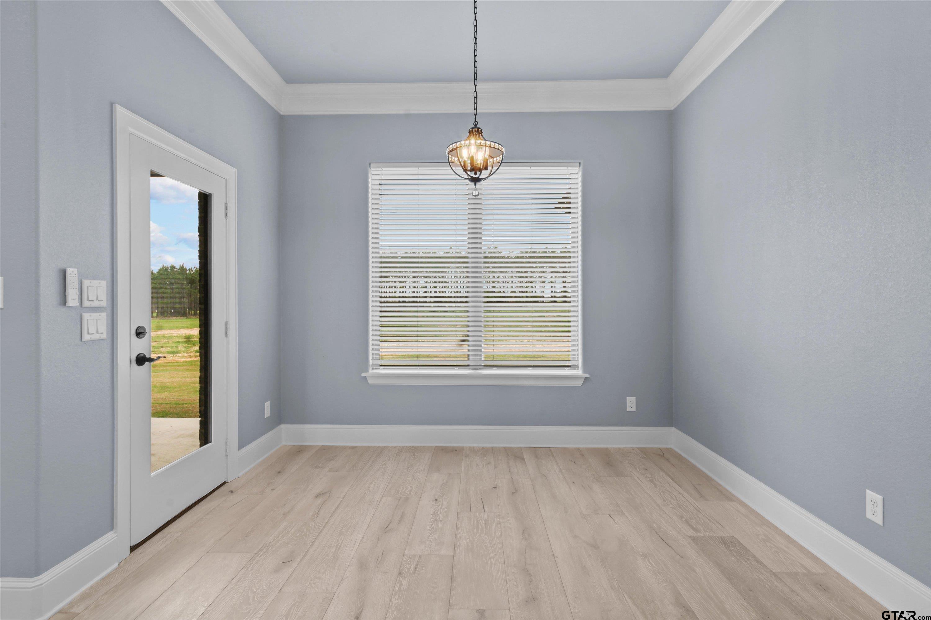 11236 Bryce Circle Flint, TX 75762 - Photo 18 of 44 an empty room with windows and entrance