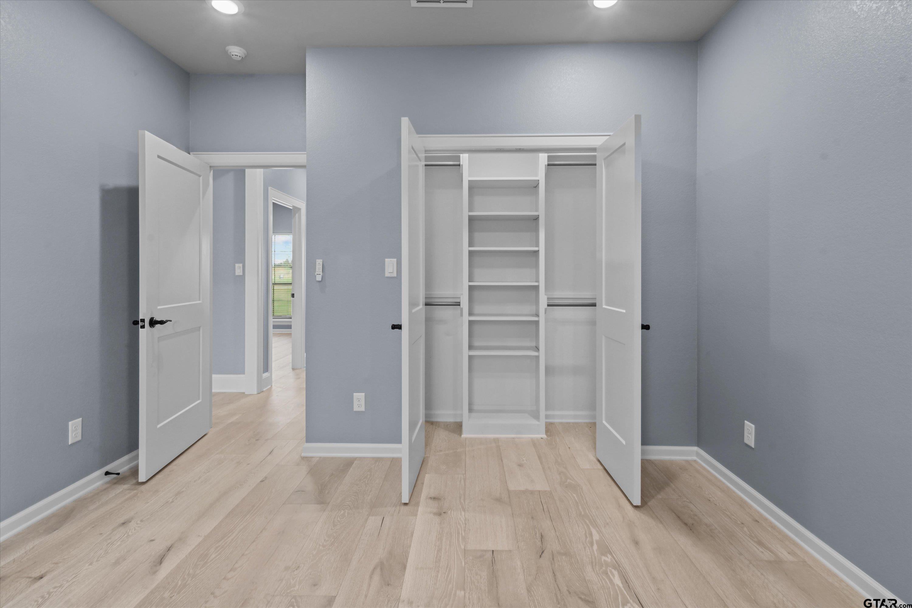 11236 Bryce Circle Flint, TX 75762 - Photo 22 of 44 wooden floor and closet in a room