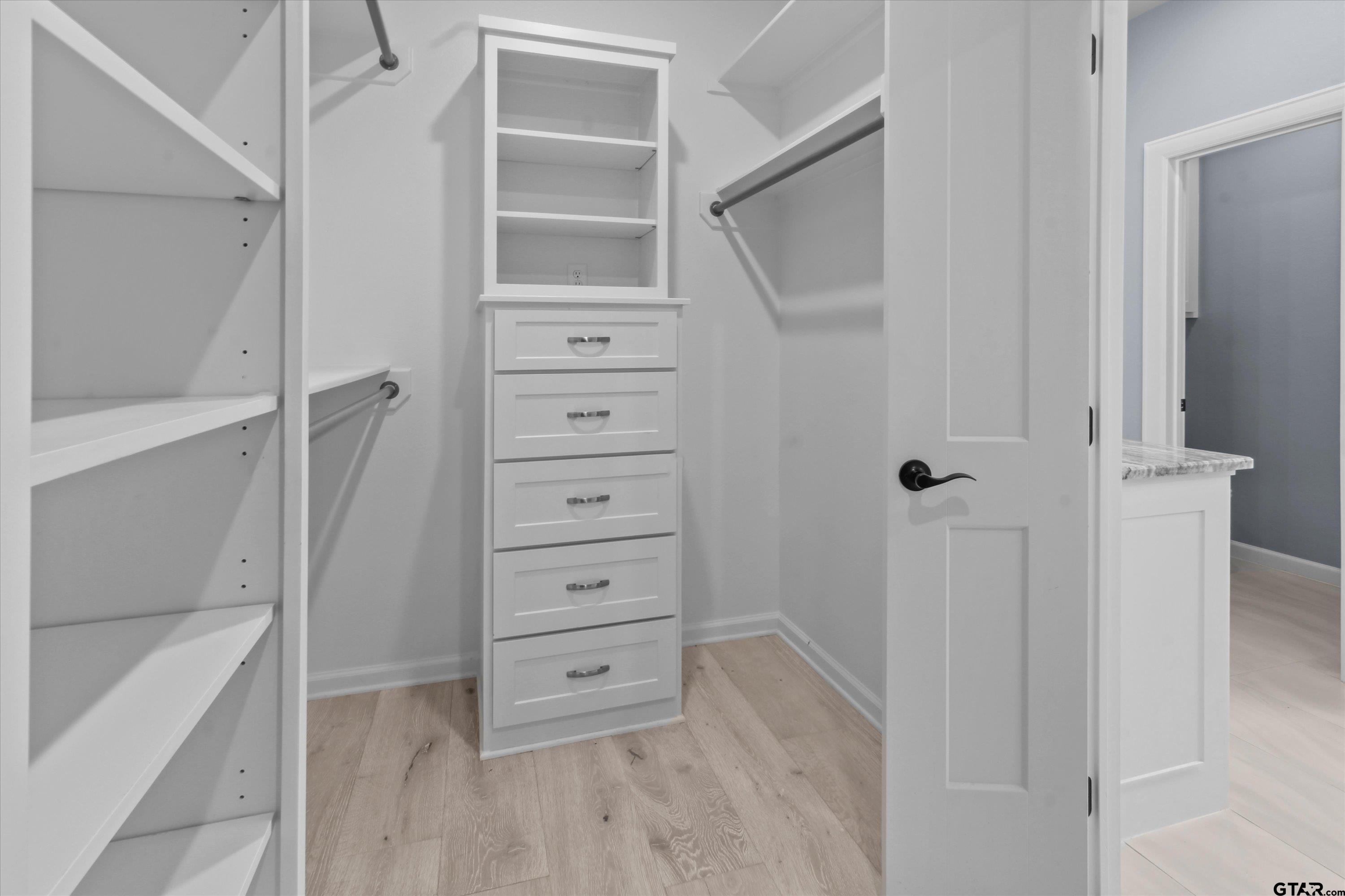 11236 Bryce Circle Flint, TX 75762 - Photo 34 of 44 a view of walk in closet with empty racks