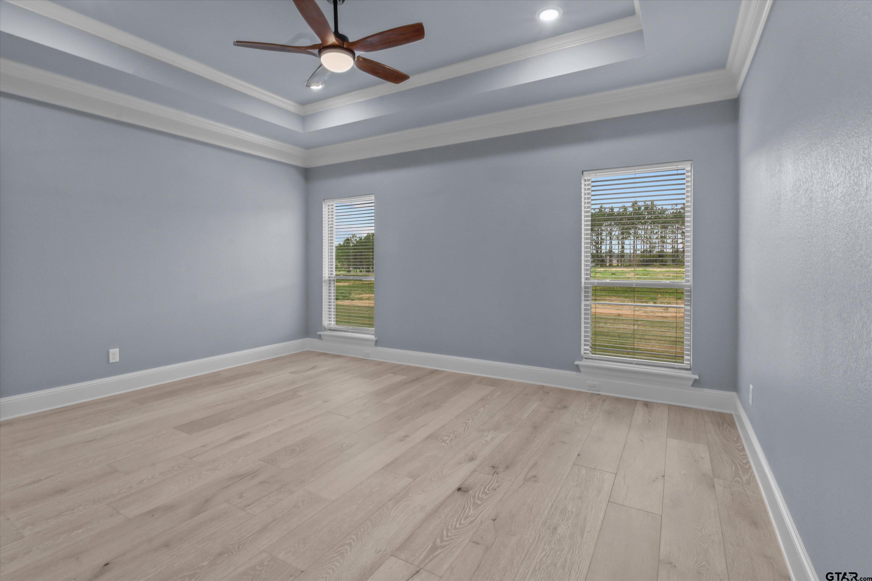 11236 Bryce Circle Flint, TX 75762 - Photo 35 of 44 an empty room with windows and fan