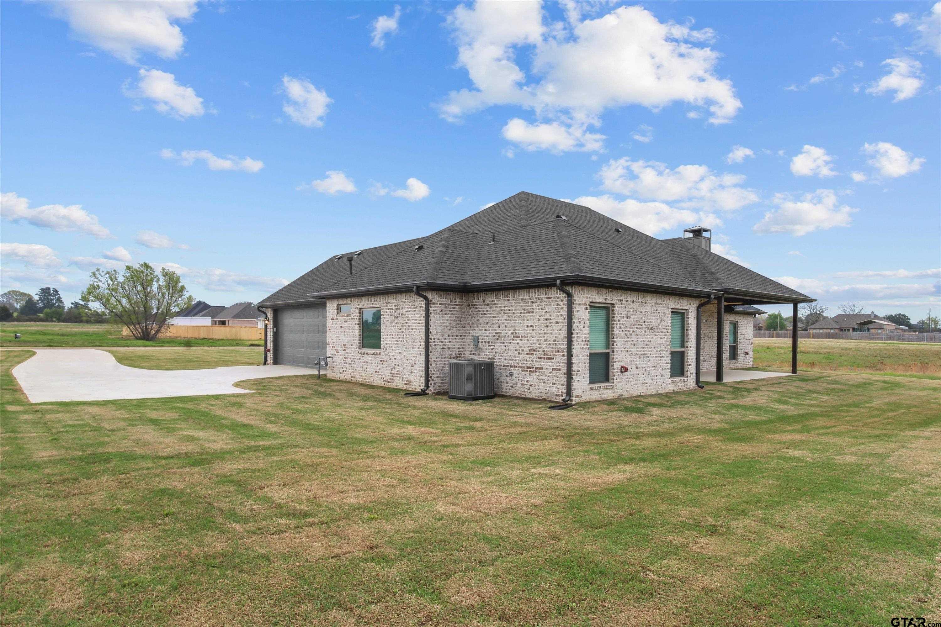11236 Bryce Circle Flint, TX 75762 - Photo 41 of 44 a big house with a big yard and large trees