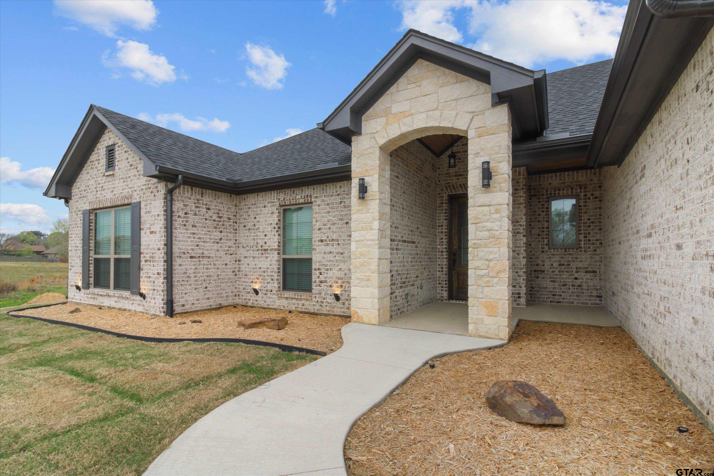 11236 Bryce Circle Flint, TX 75762 - Photo 5 of 44 a view of a house with more windows and wooden fence
