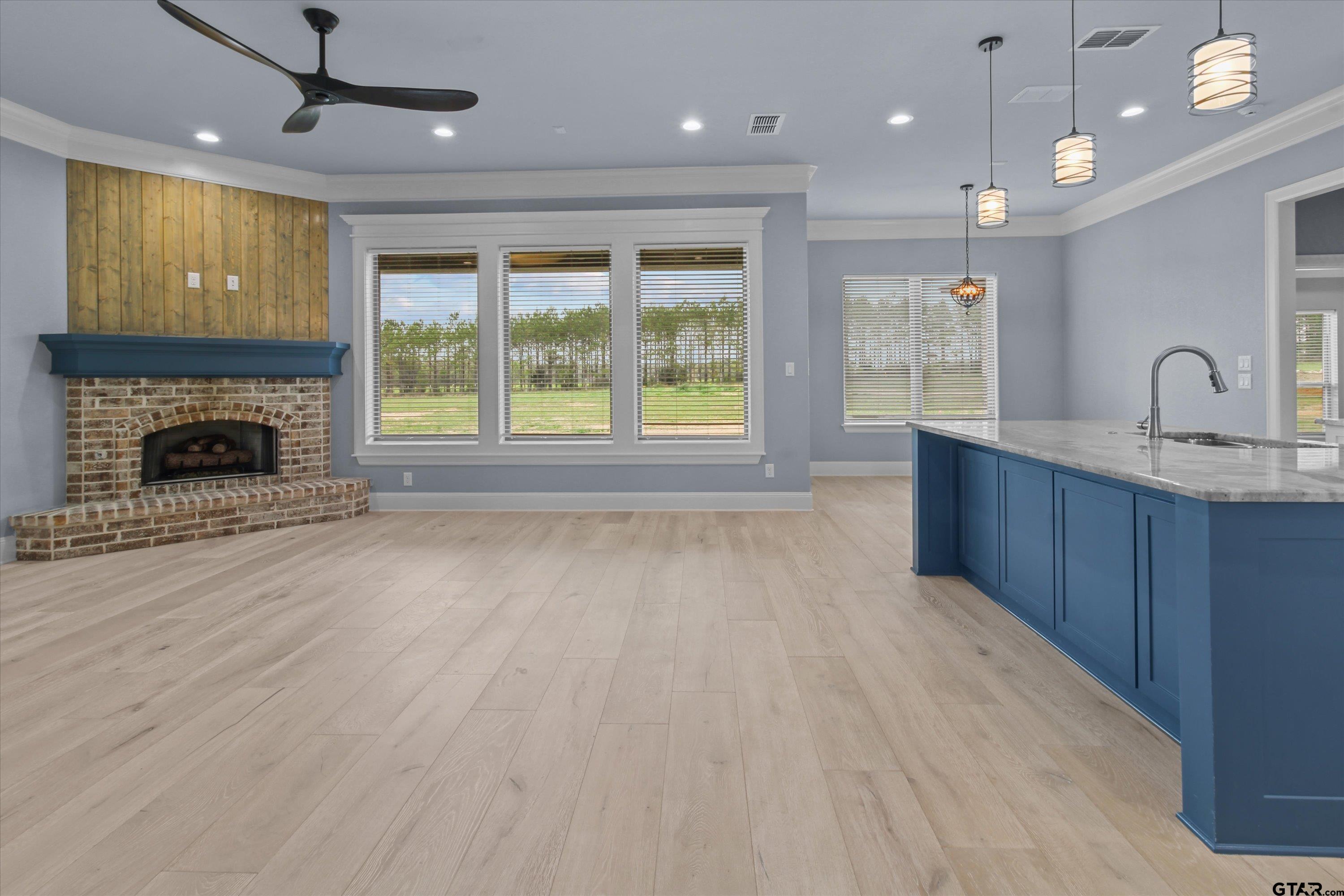 11236 Bryce Circle Flint, TX 75762 - Photo 10 of 44 a open kitchen with window and a fireplace