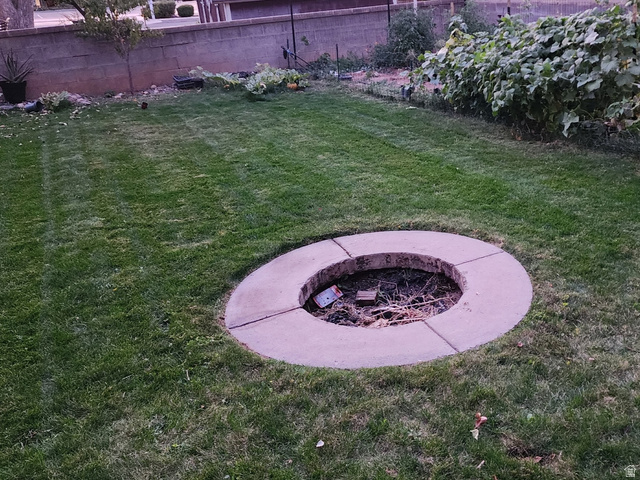 574 West Harding Avenue Cedar City, UT 84720 - Photo 32 of 43 Fenced backyard featuring an outdoor fire pit
