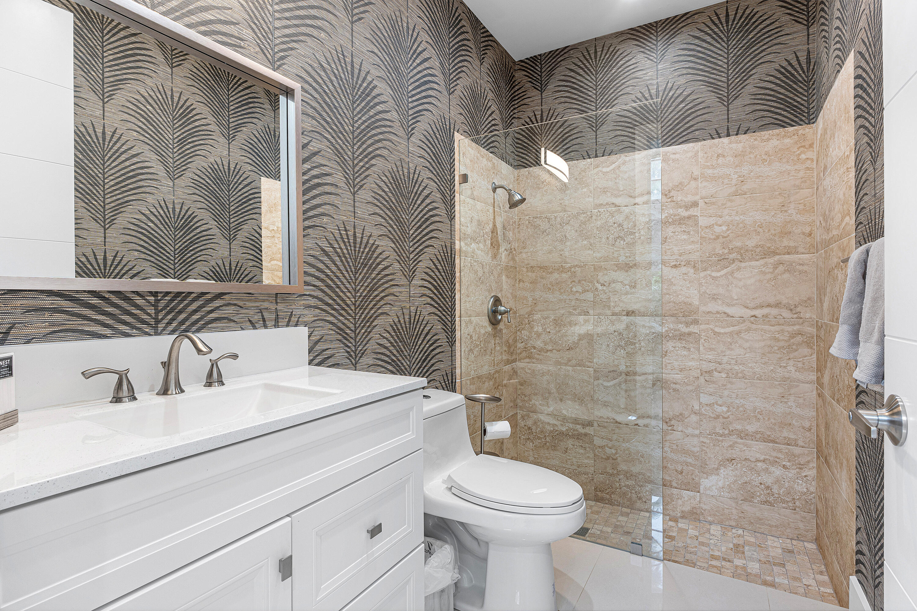 2197 Northwest 59th Street Boca Raton, FL 33496 - Photo 13 of 62 a bathroom with a sink a toilet and shower