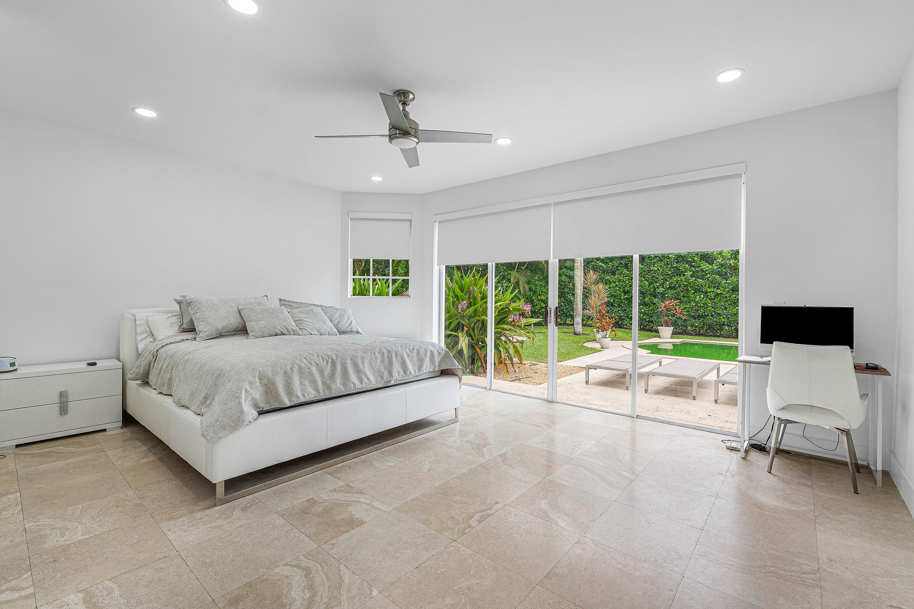 2197 Northwest 59th Street Boca Raton, FL 33496 - Photo 18 of 62 a spacious bedroom with a bed and a large window