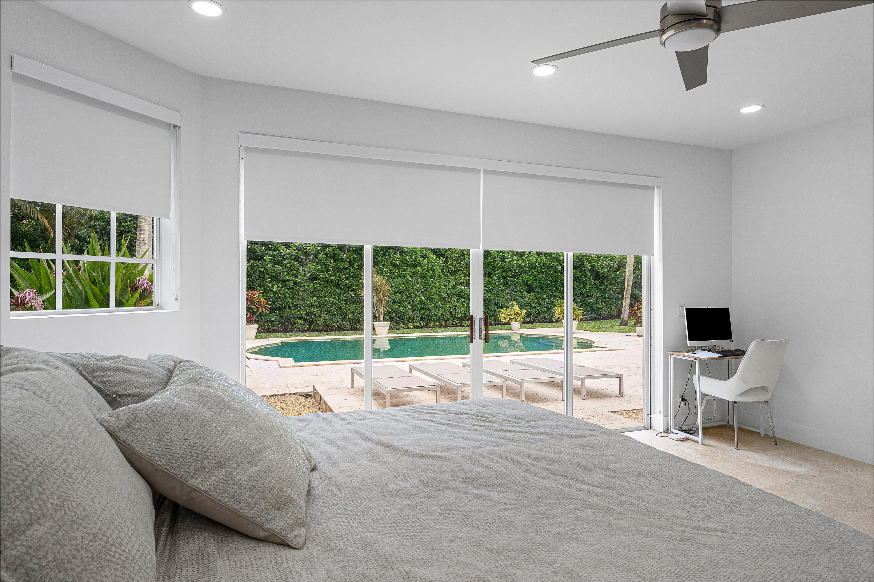 2197 Northwest 59th Street Boca Raton, FL 33496 - Photo 19 of 62 a bed sitting in a bedroom next to a window