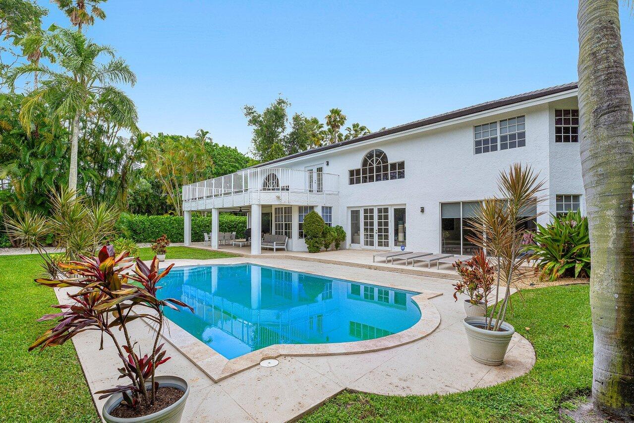 2197 Northwest 59th Street Boca Raton, FL 33496 - Photo 2 of 62 a view of a house with pool and chairs