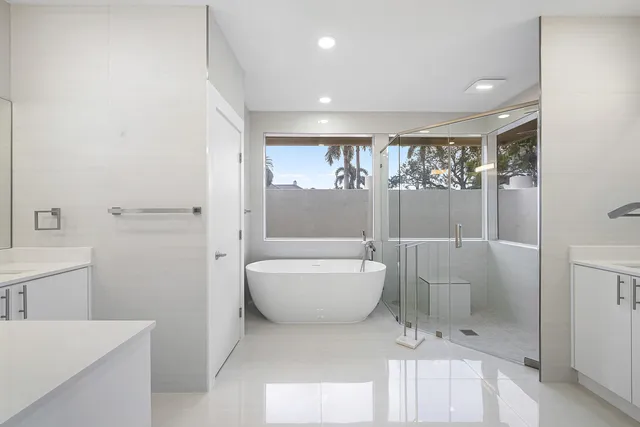 a bathroom with a sink double vanity and a mirror
