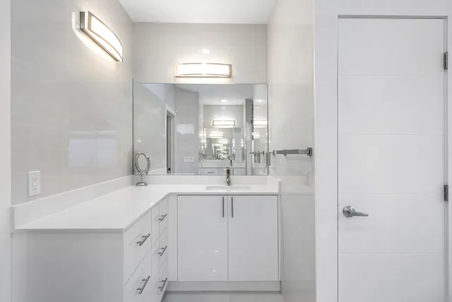 a view of living room with a sink and chandelier