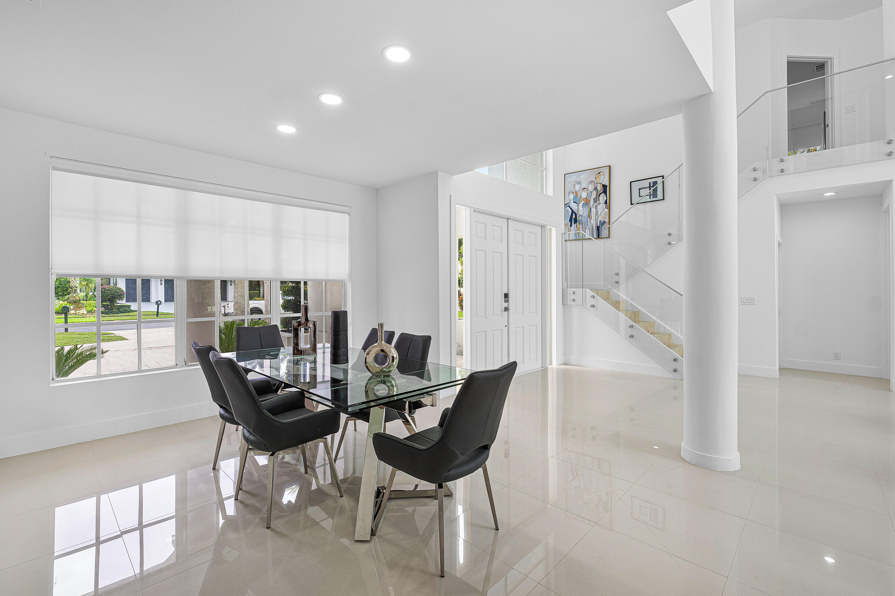 2197 Northwest 59th Street Boca Raton, FL 33496 - Photo 26 of 62 a dining room with furniture and a floor to ceiling window