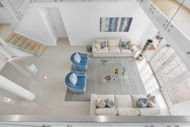 a bathroom with a double vanity sink toilet and a mirror