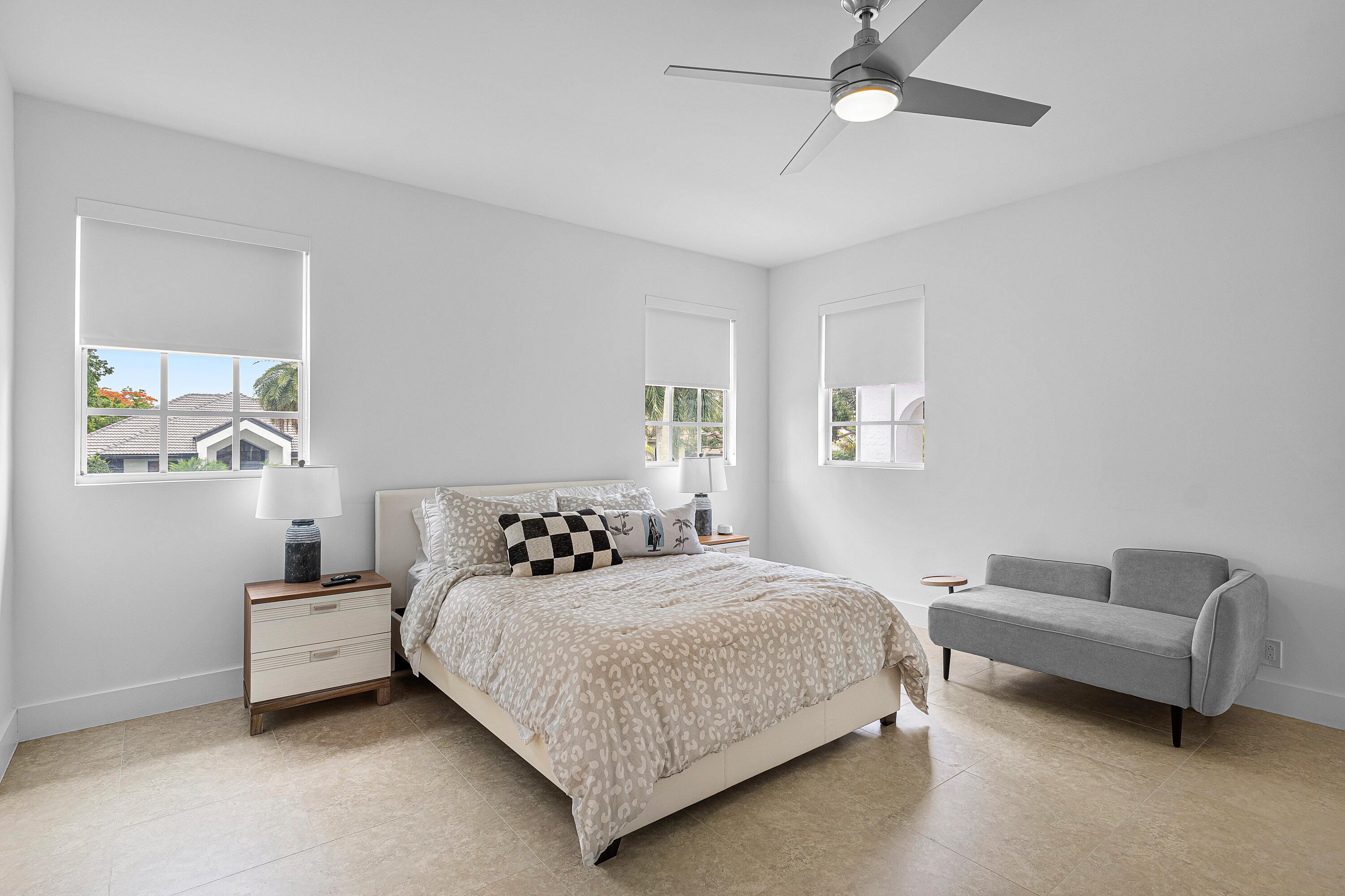 2197 Northwest 59th Street Boca Raton, FL 33496 - Photo 33 of 62 a bedroom with a bed and a couch