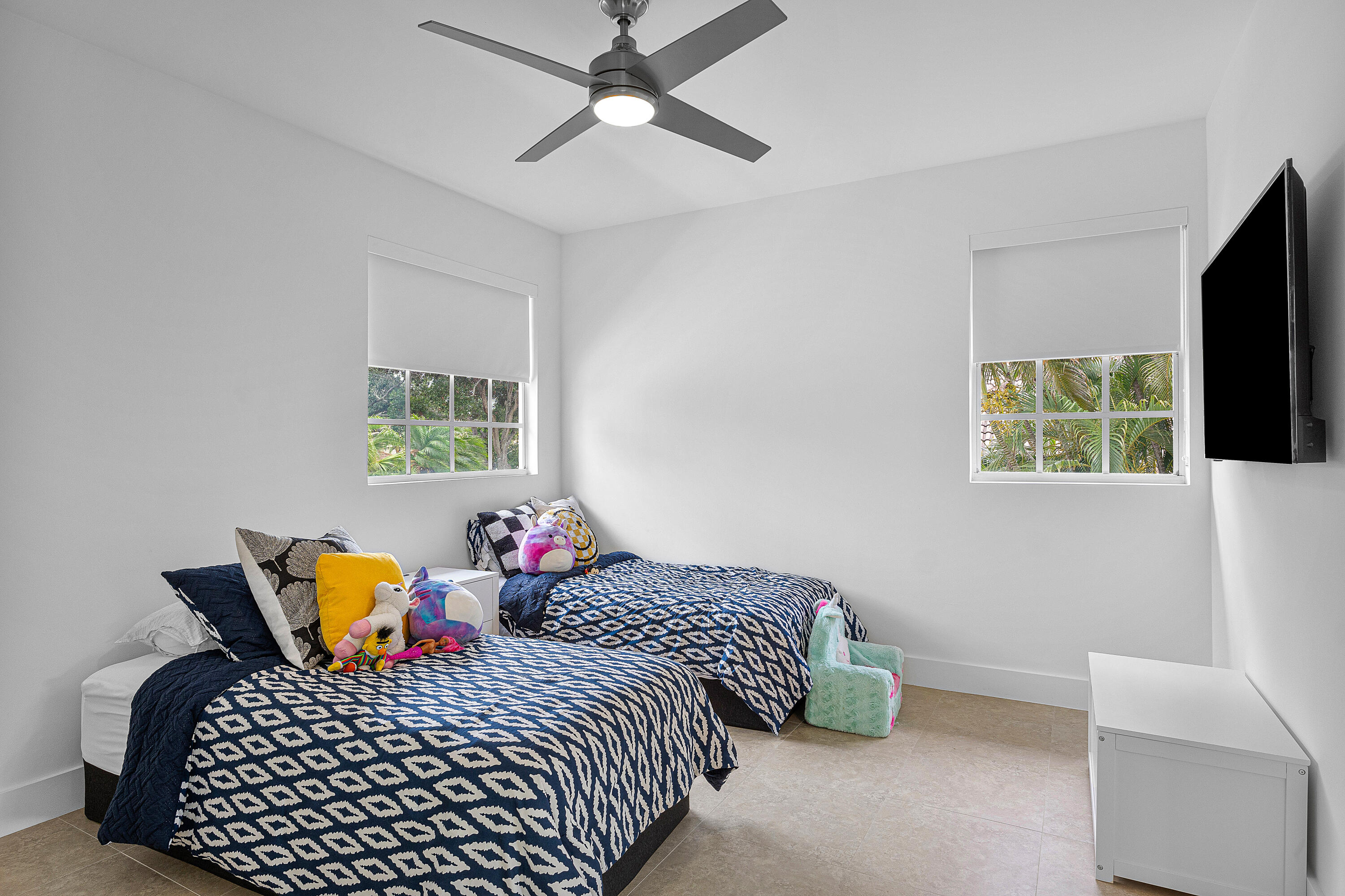 2197 Northwest 59th Street Boca Raton, FL 33496 - Photo 37 of 62 a bedroom with two beds and a chandelier