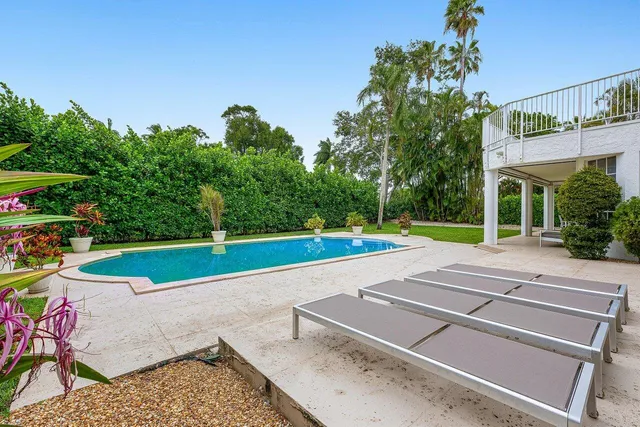 a view of a swimming pool with a patio
