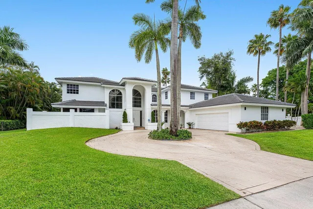 a swimming pool with outdoor seating and yard