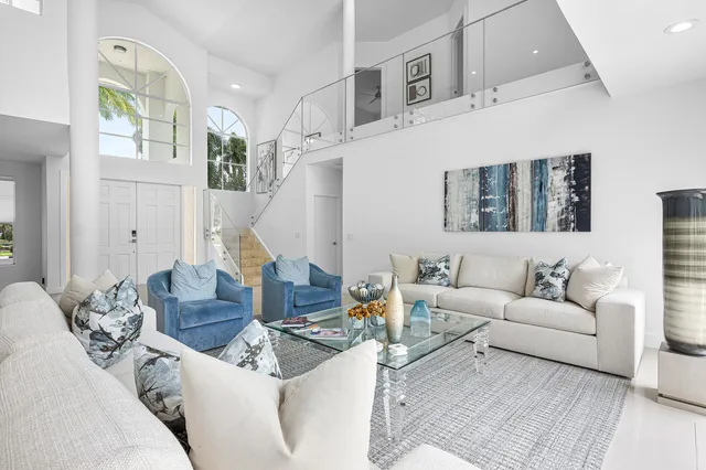 a living room with furniture and a clock