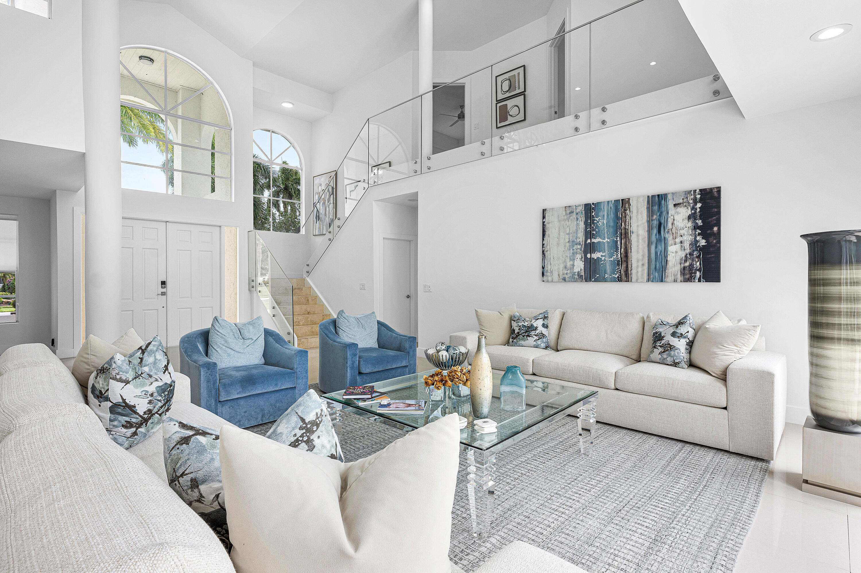 2197 Northwest 59th Street Boca Raton, FL 33496 - Photo 5 of 62 a living room with furniture and a clock