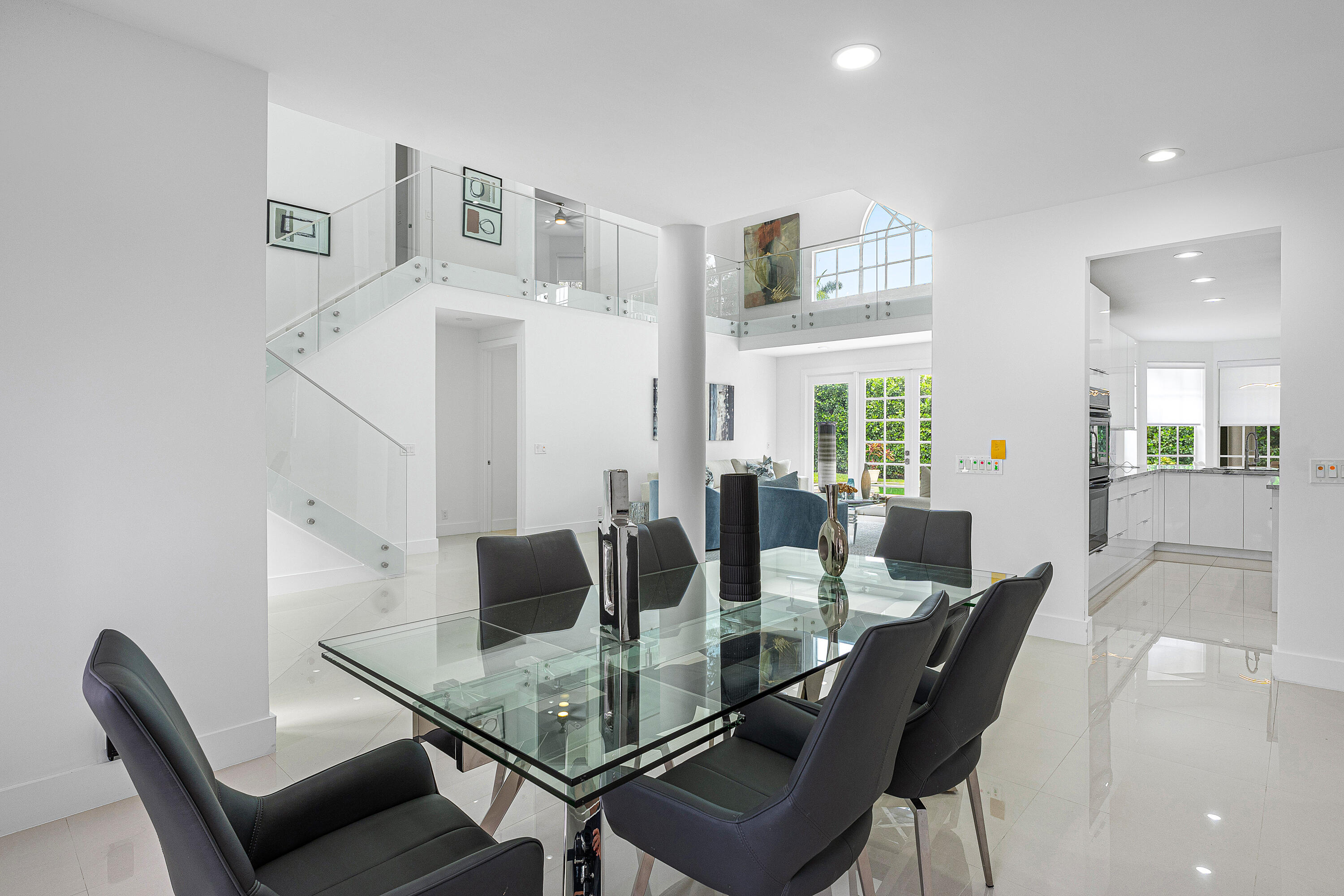 2197 Northwest 59th Street Boca Raton, FL 33496 - Photo 8 of 62 a view of a dining room with furniture and wooden floor