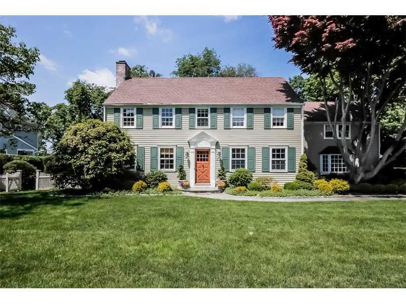 a aerial view of a house with a yard table and chairs
